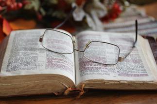 worn-open-bible-glasses-very-marked-pair-resting-pages-46865401